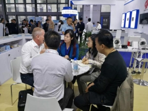 Raycome staffs talking to clients