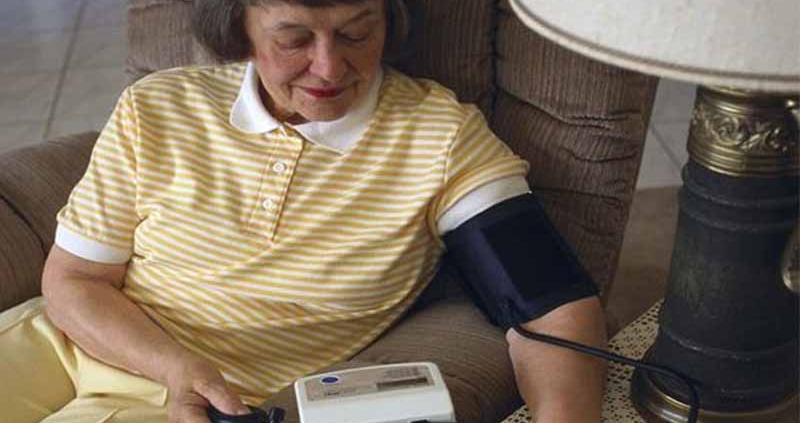 A Person Checking their Blood Pressure at Home