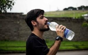 Man drinking a bottle of water