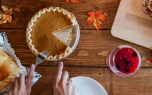 A person slicing pie