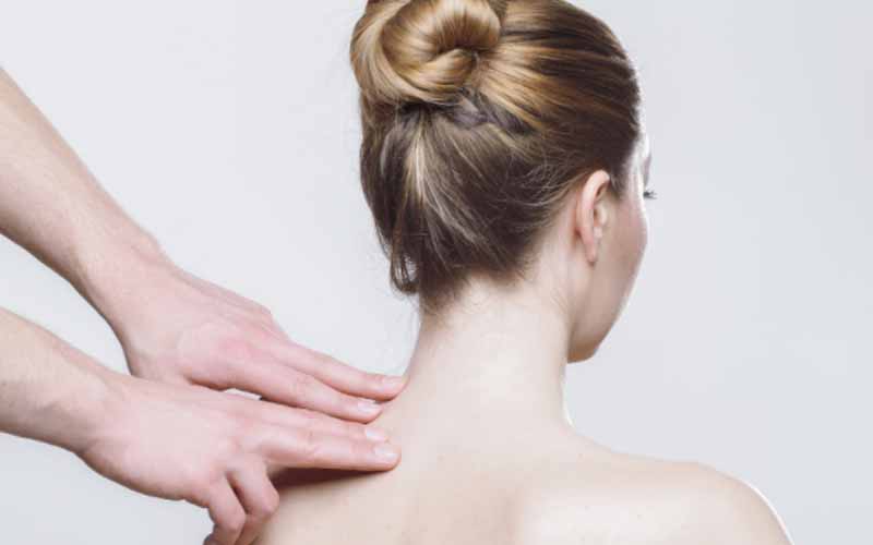 Massage treatment on shoulders to cure pain