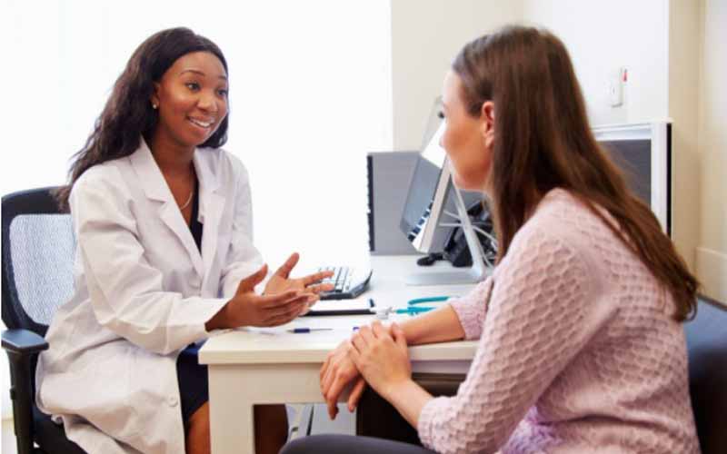 A doctor speaking to a patient