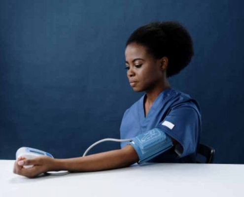 A lady measuring her blood pressure