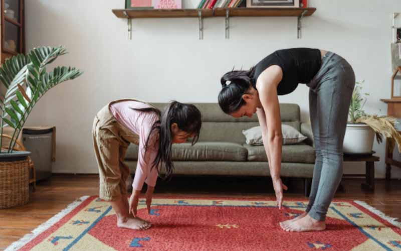 Mother and daughter exercising together