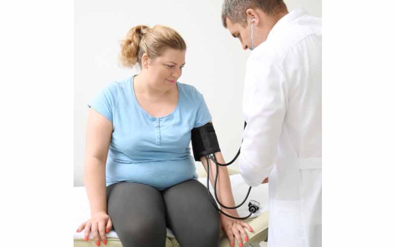 Woman getting her blood pressure measured